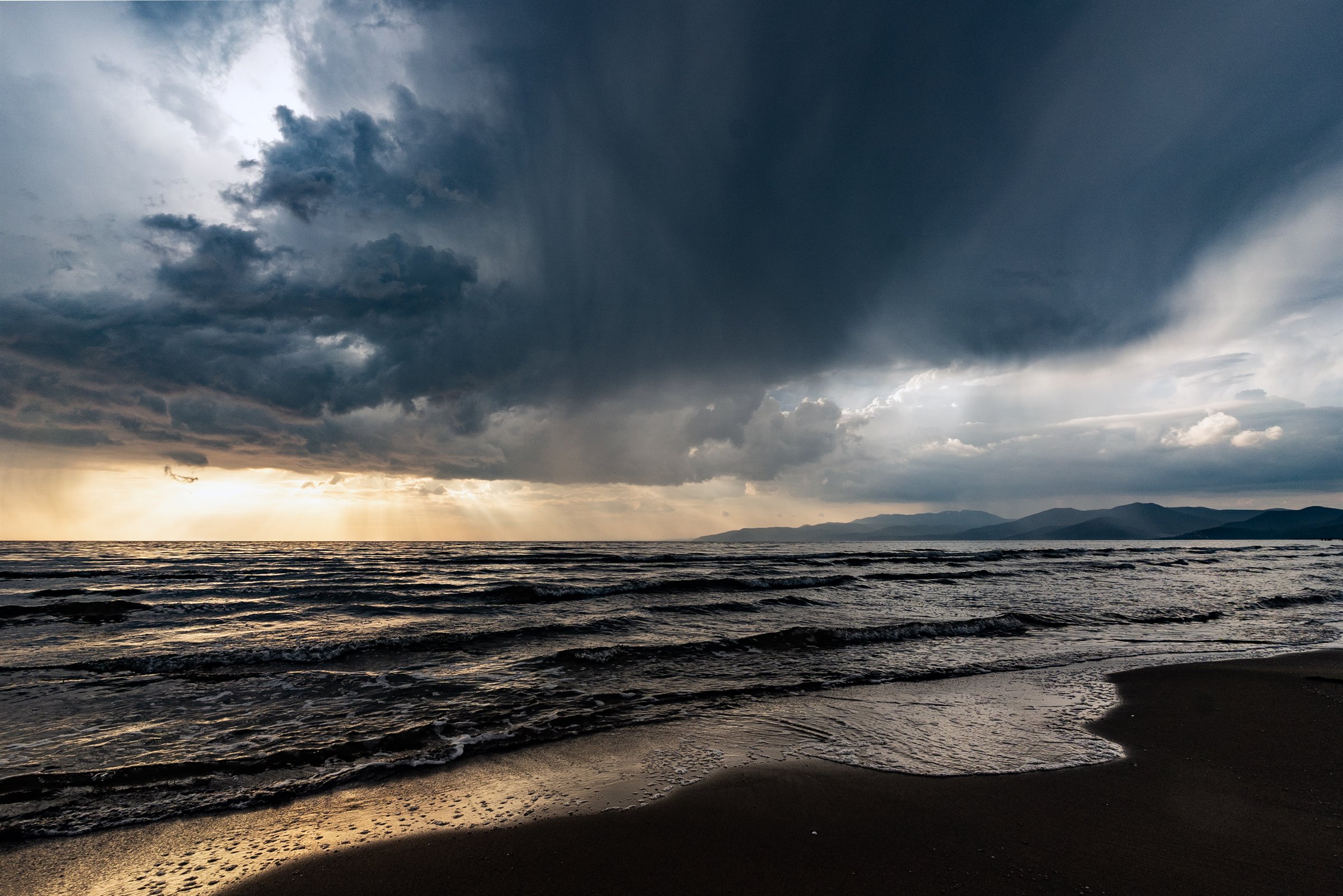 Dramatic coastal sky and waves photographed by Peter Szafel