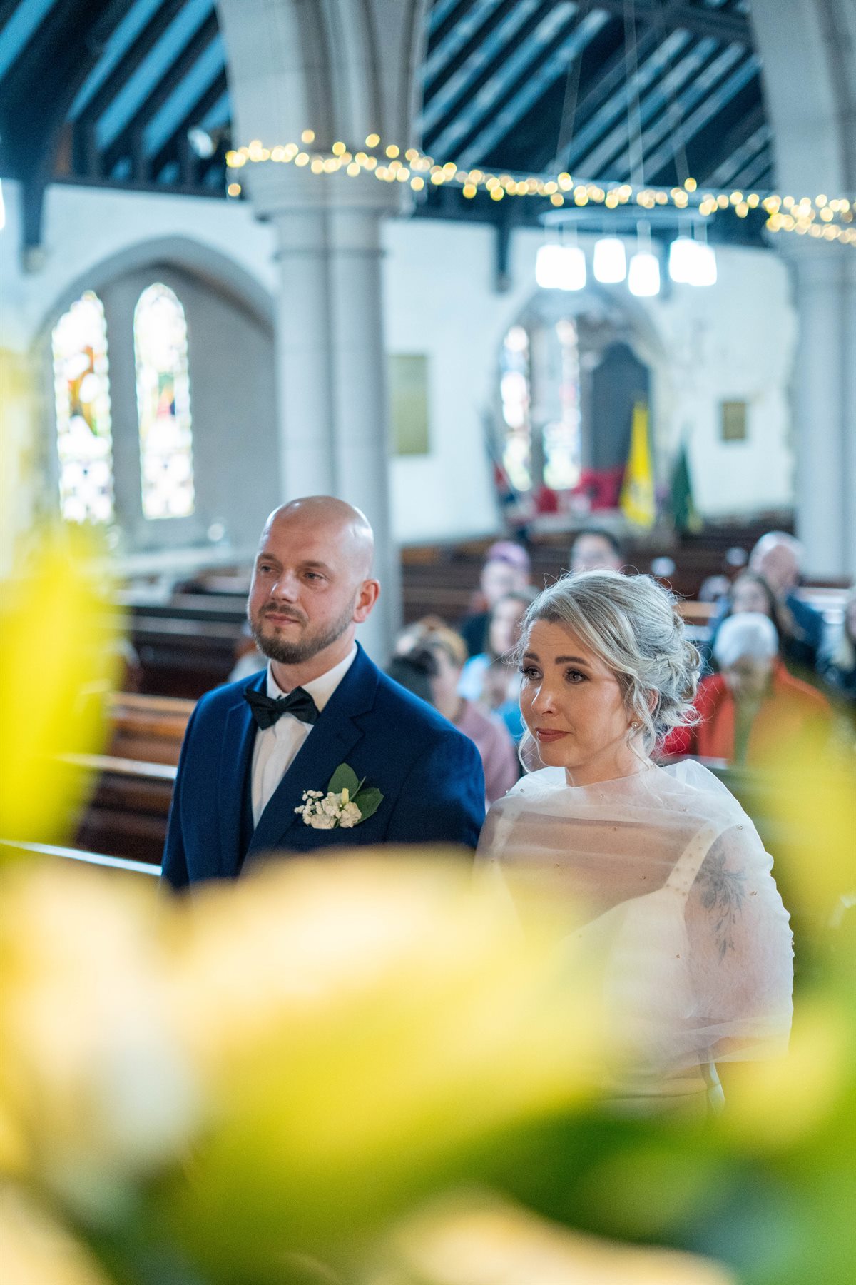 Bride and groom during ceremony by Peter Szafel